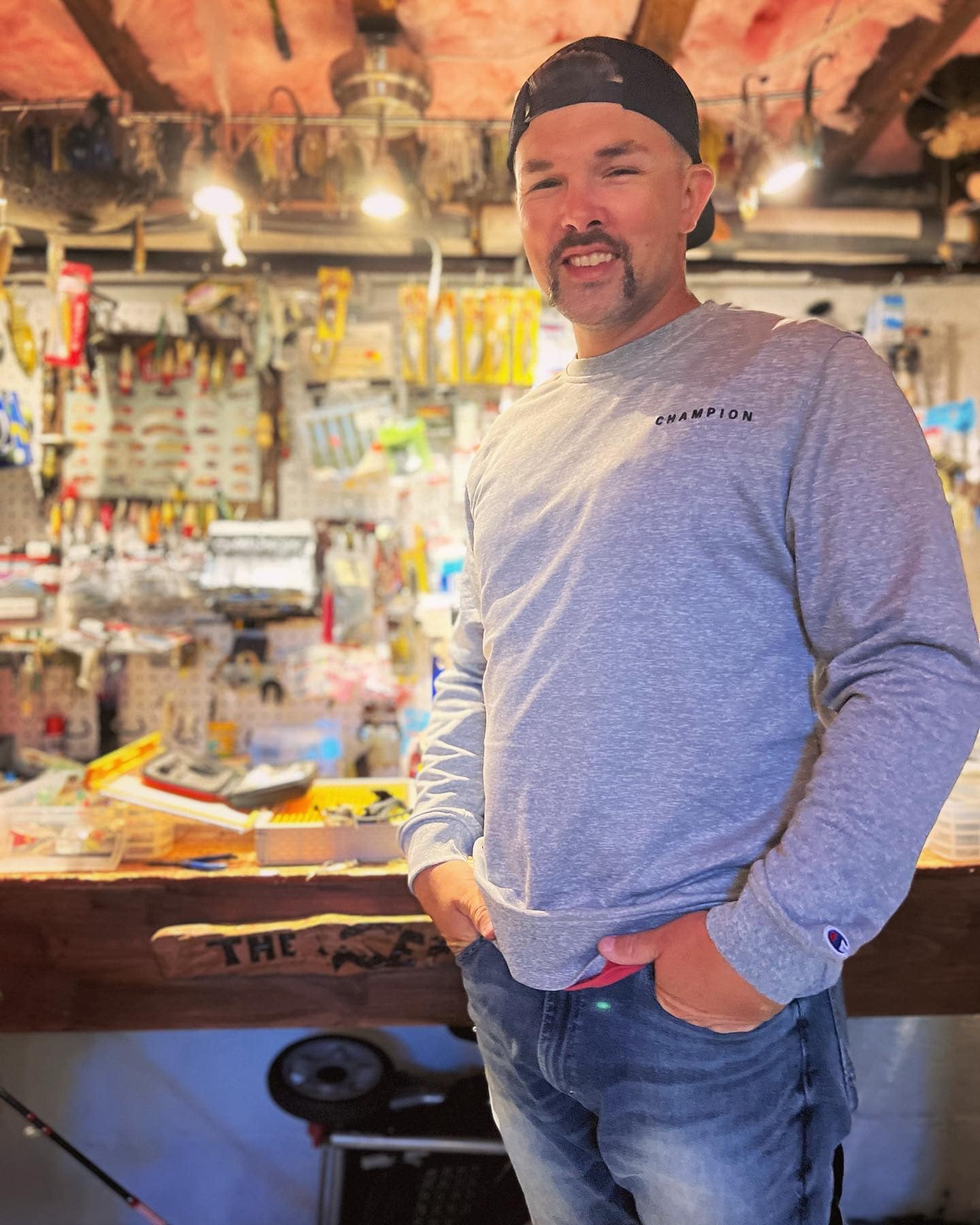 Robert, owner of Budget Home Improvement, in his workshop with tools and equipment