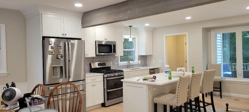 Kitchen island installation with custom cabinetry
