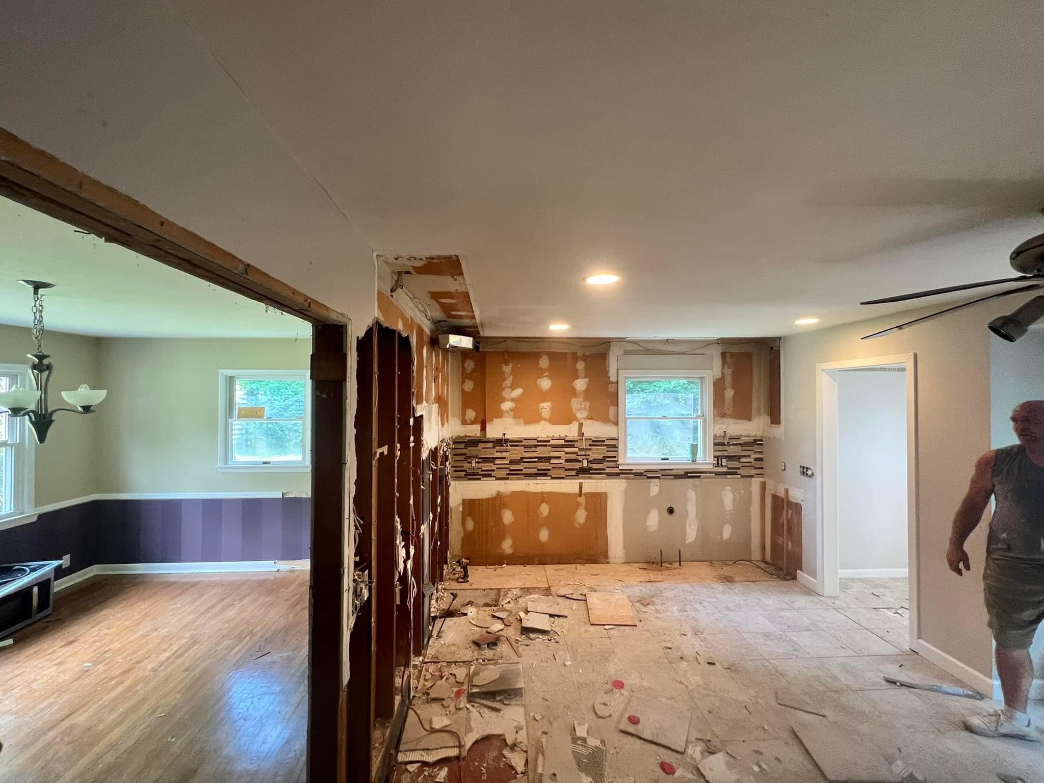 Major home renovation showing open floor plan construction and kitchen remodel