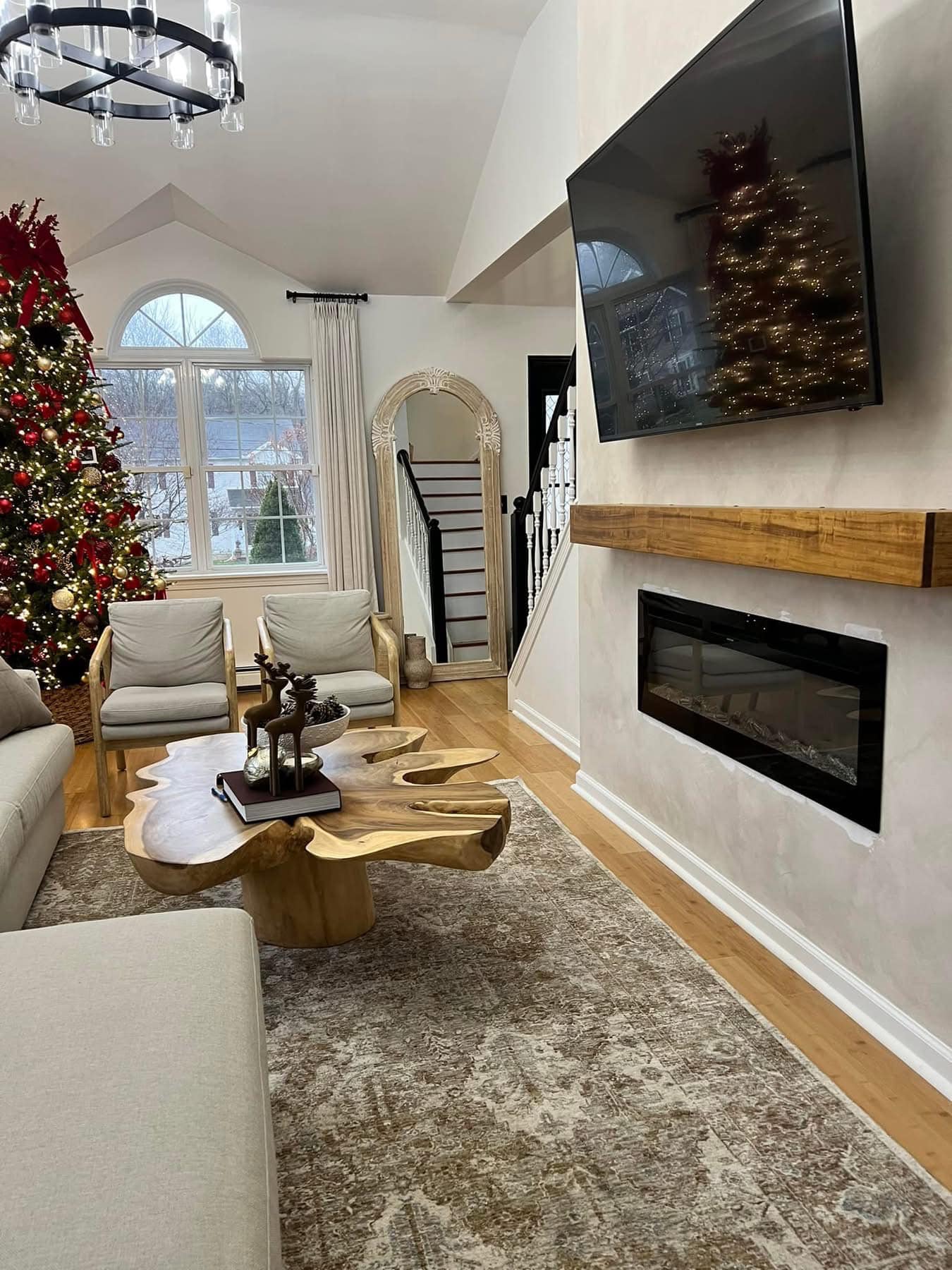 Completed living room renovation with modern fireplace and elegant finishes